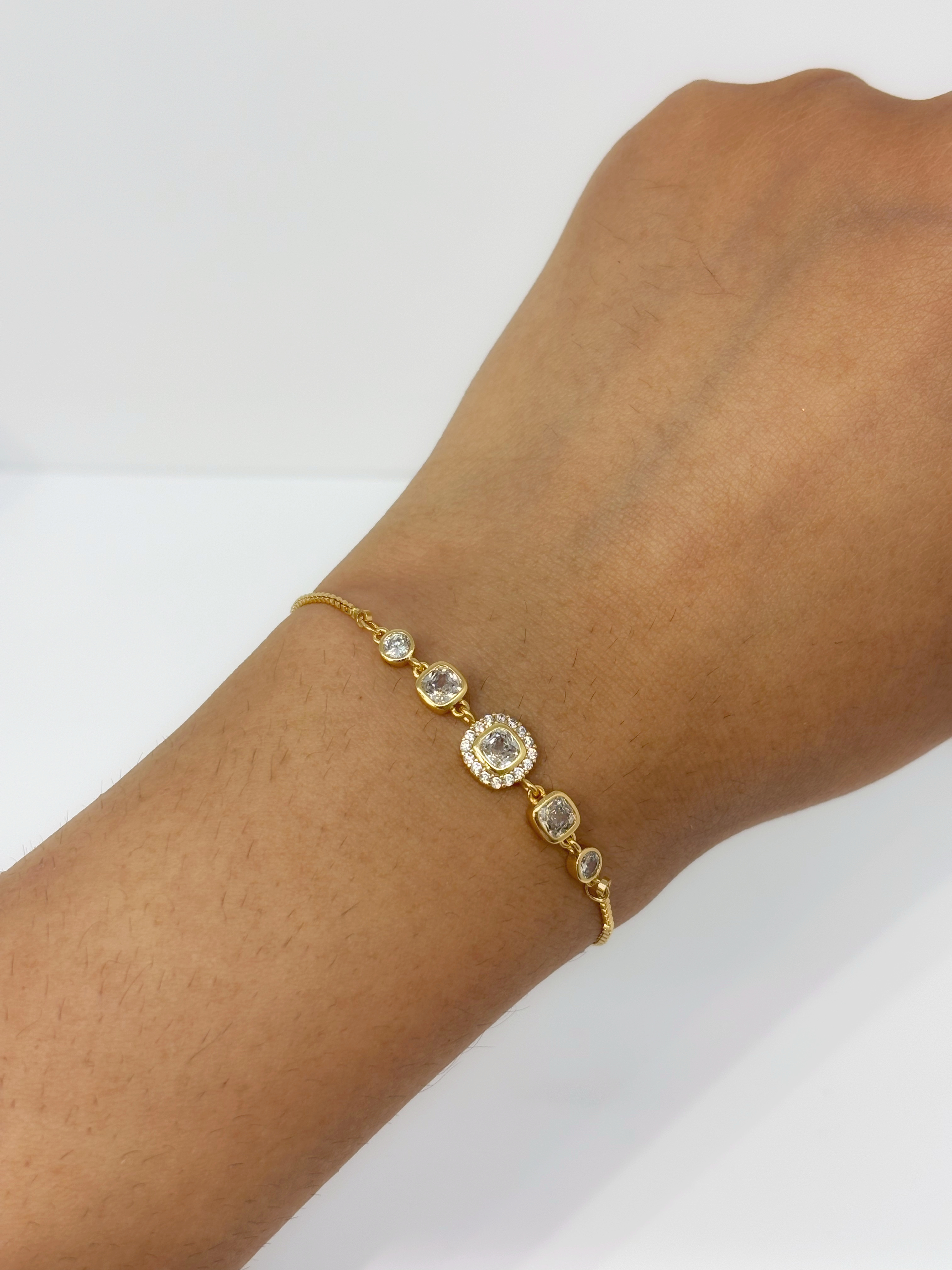 Bezel Crystal gold plated bracelet worn on wrist
