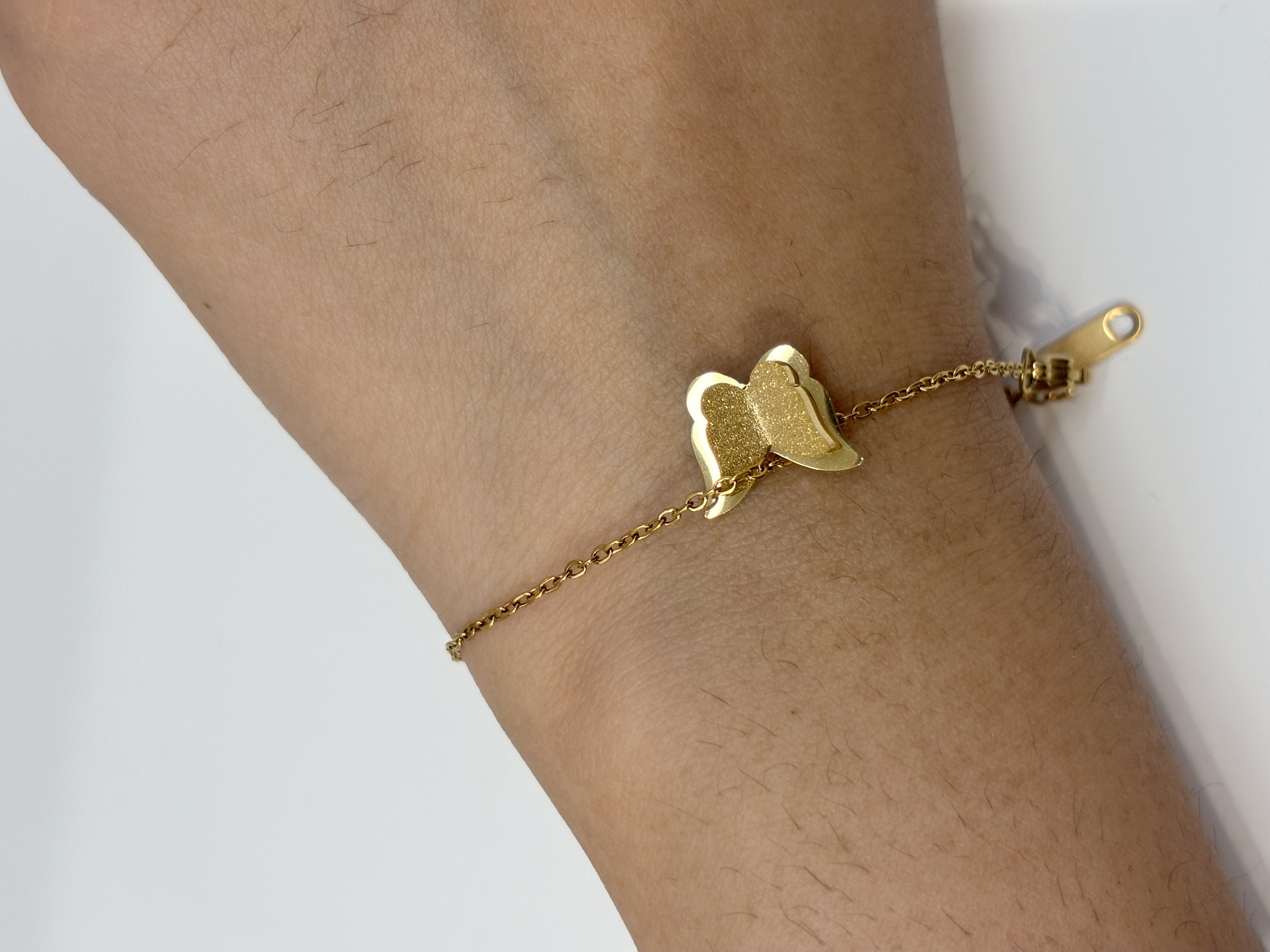 Butterfly Duo gold plated bracelet worn on wrist
