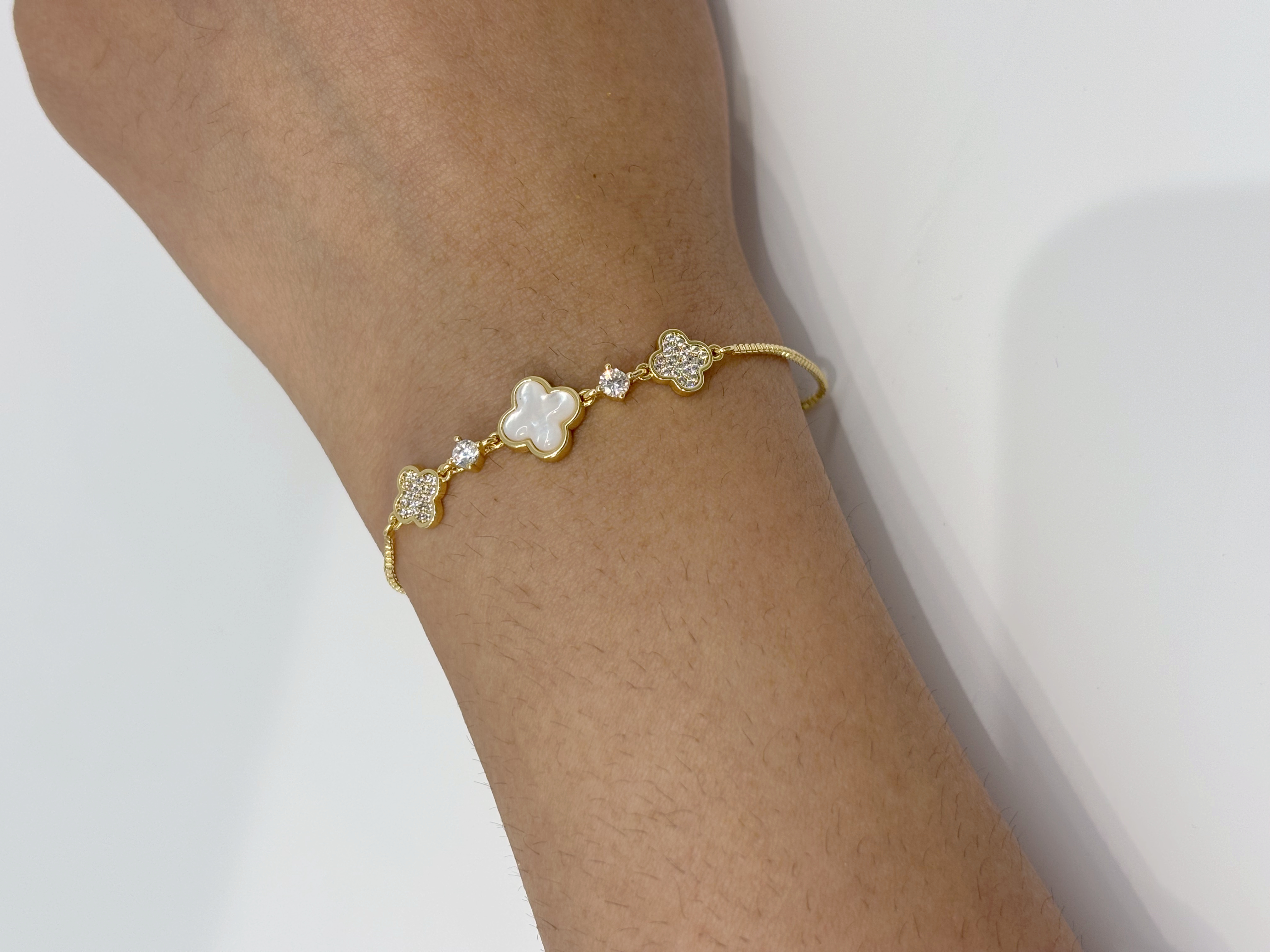 Clover Crystal gold plated bracelet worn on wrist