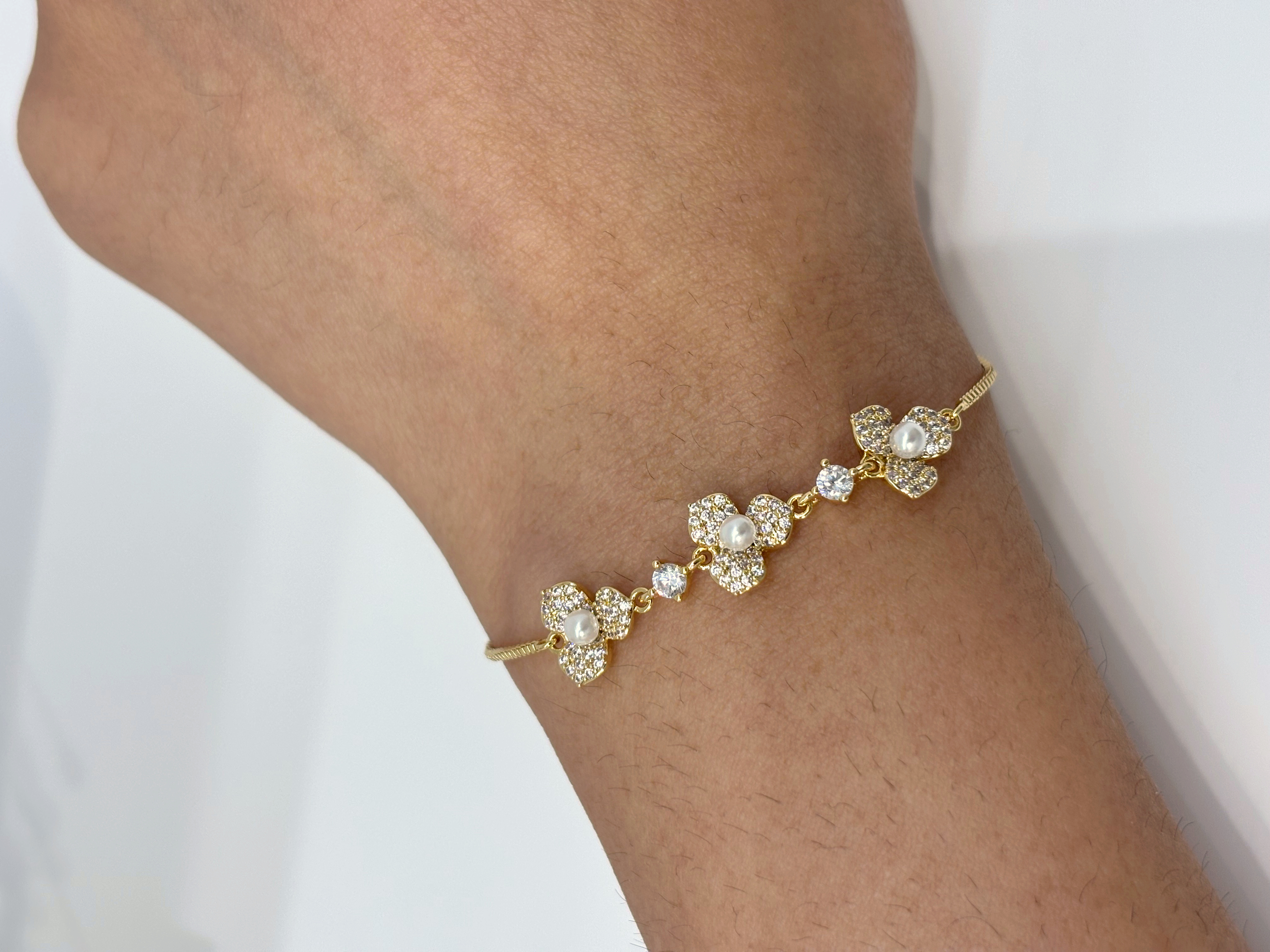 Crystal Flower Cluster gold plated bracelet worn on wrist