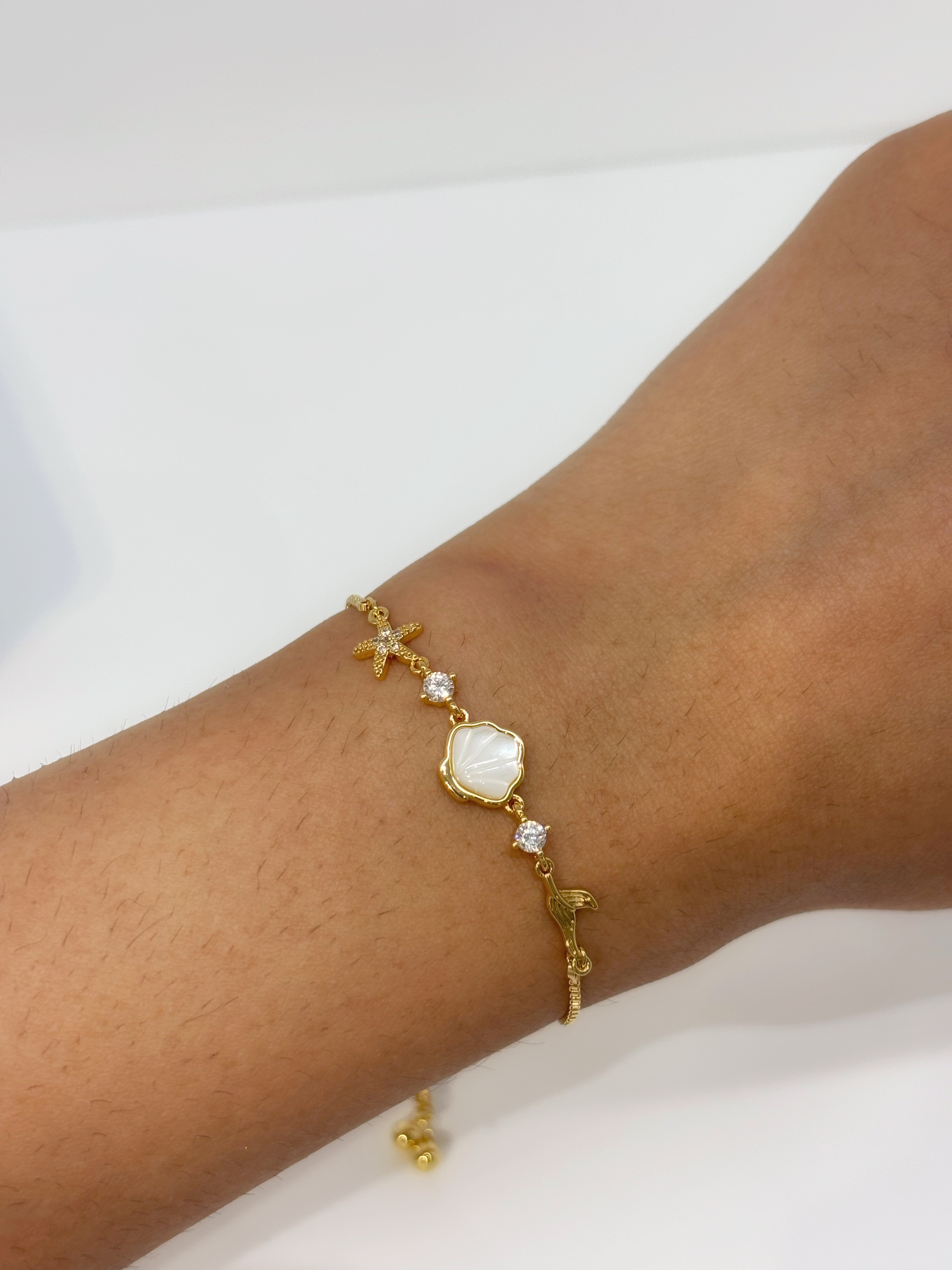 Crystal Heart Link gold plated bracelet worn on wrist