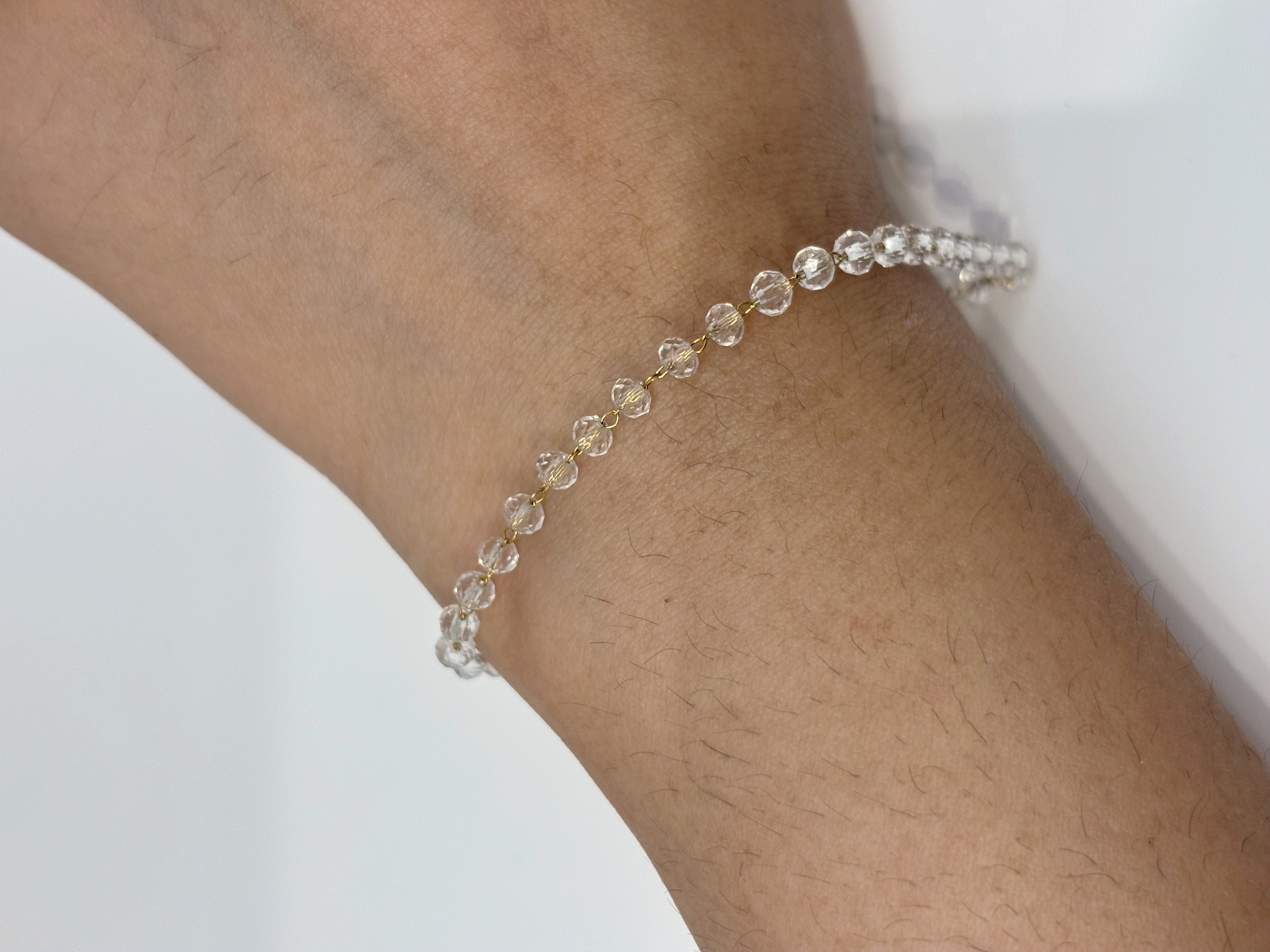 Crystal Tennis gold plated bracelet worn on wrist