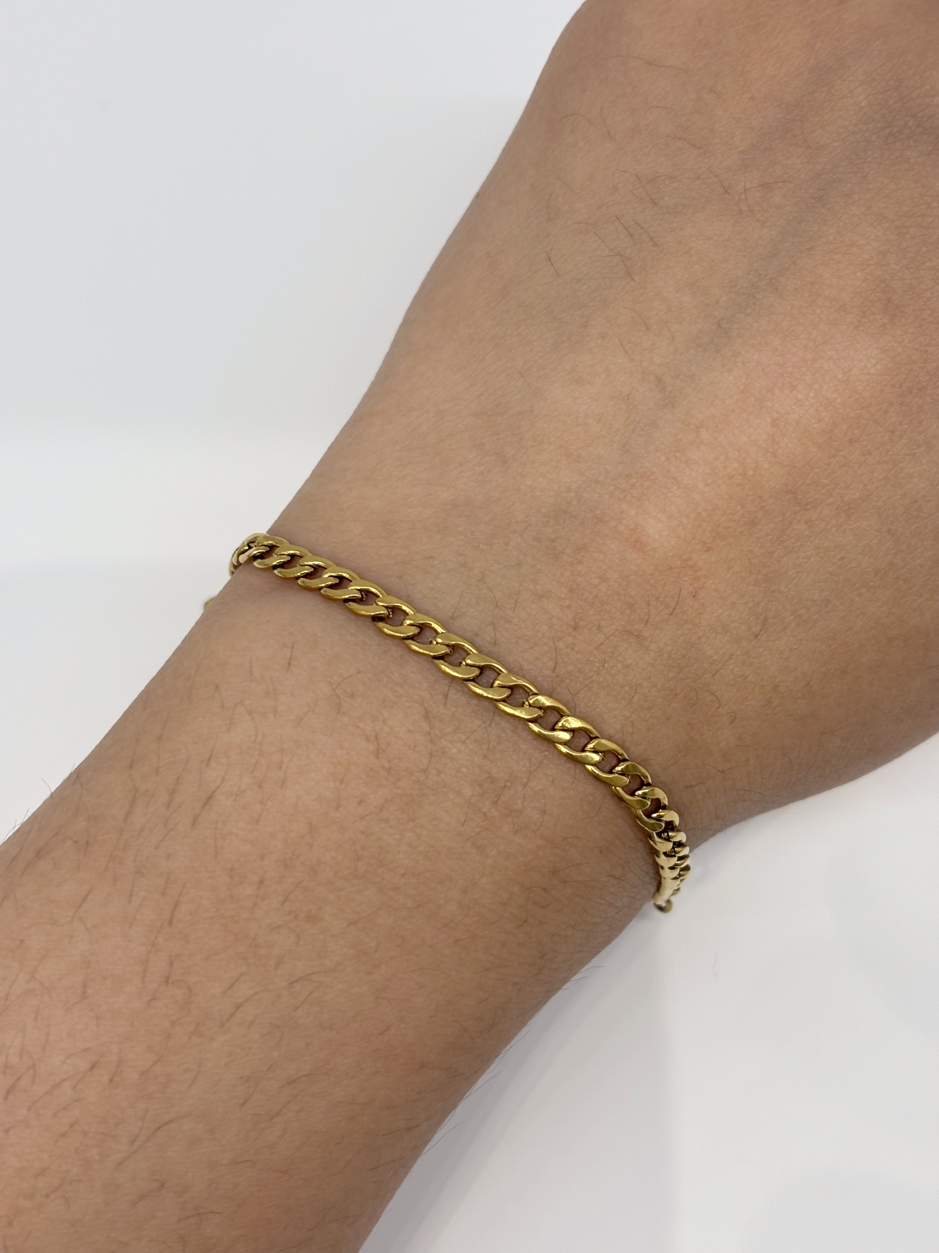 Cuban Chain gold plated bracelet worn on wrist