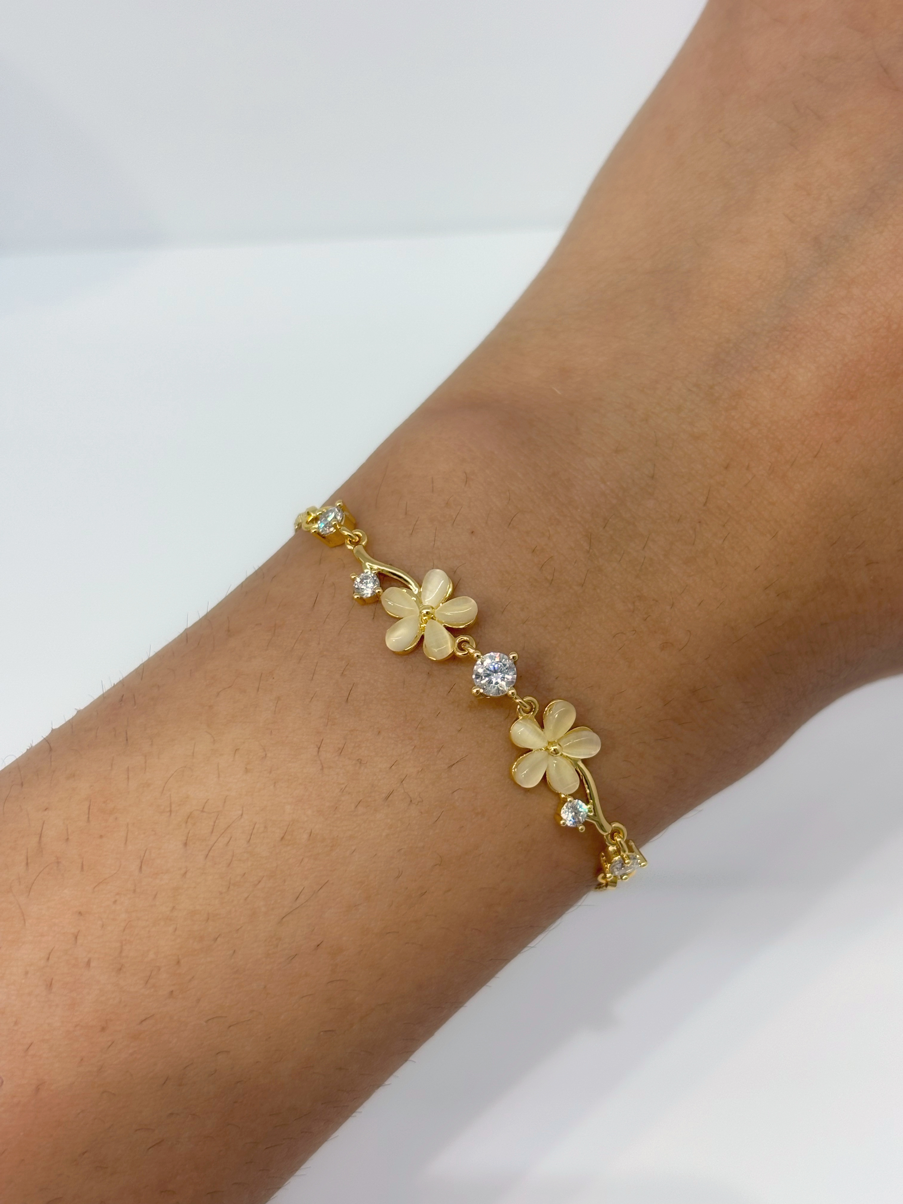 Daisy Flower gold plated bracelet worn on wrist