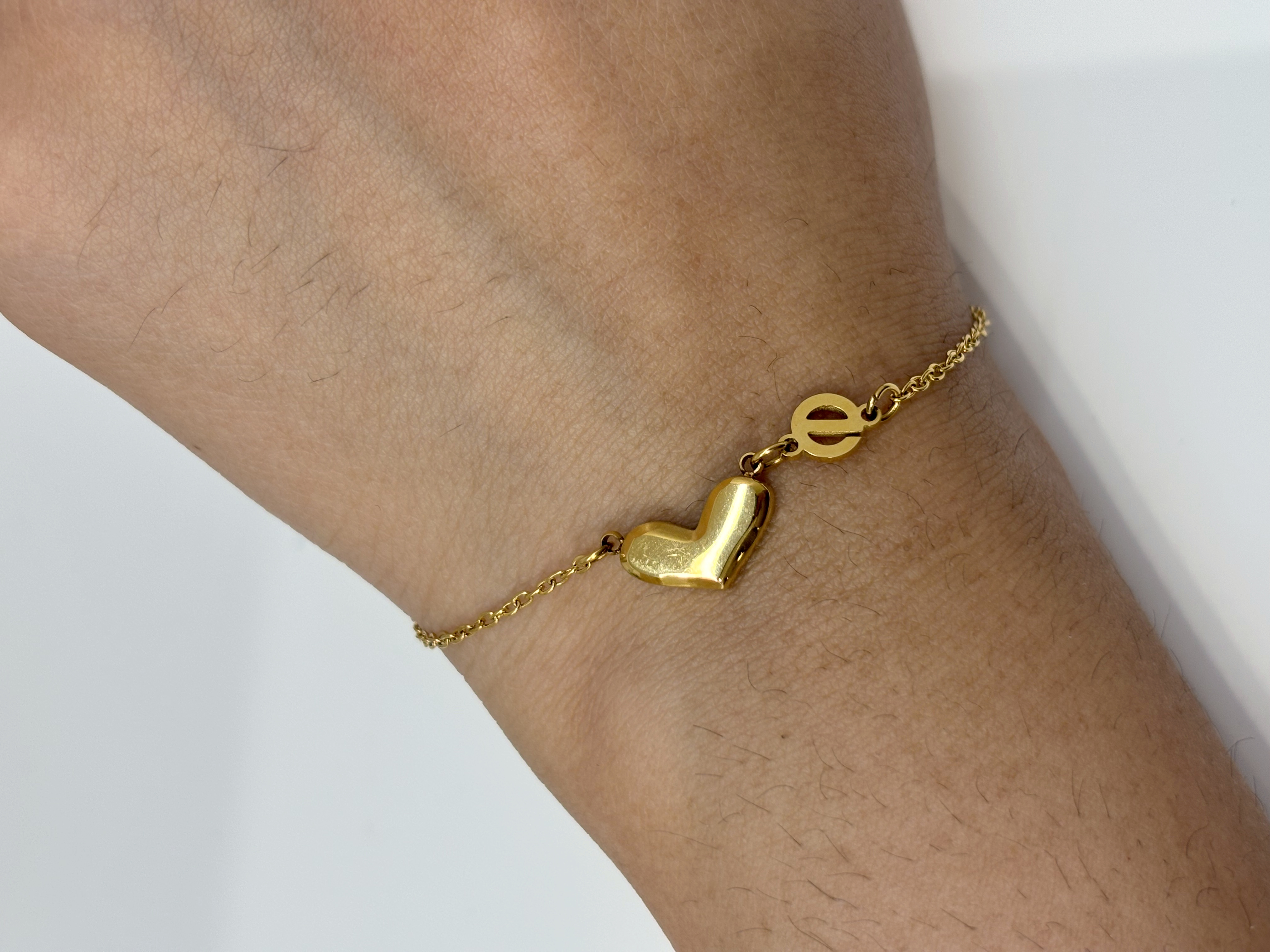 Double Heart gold plated bracelet worn on wrist