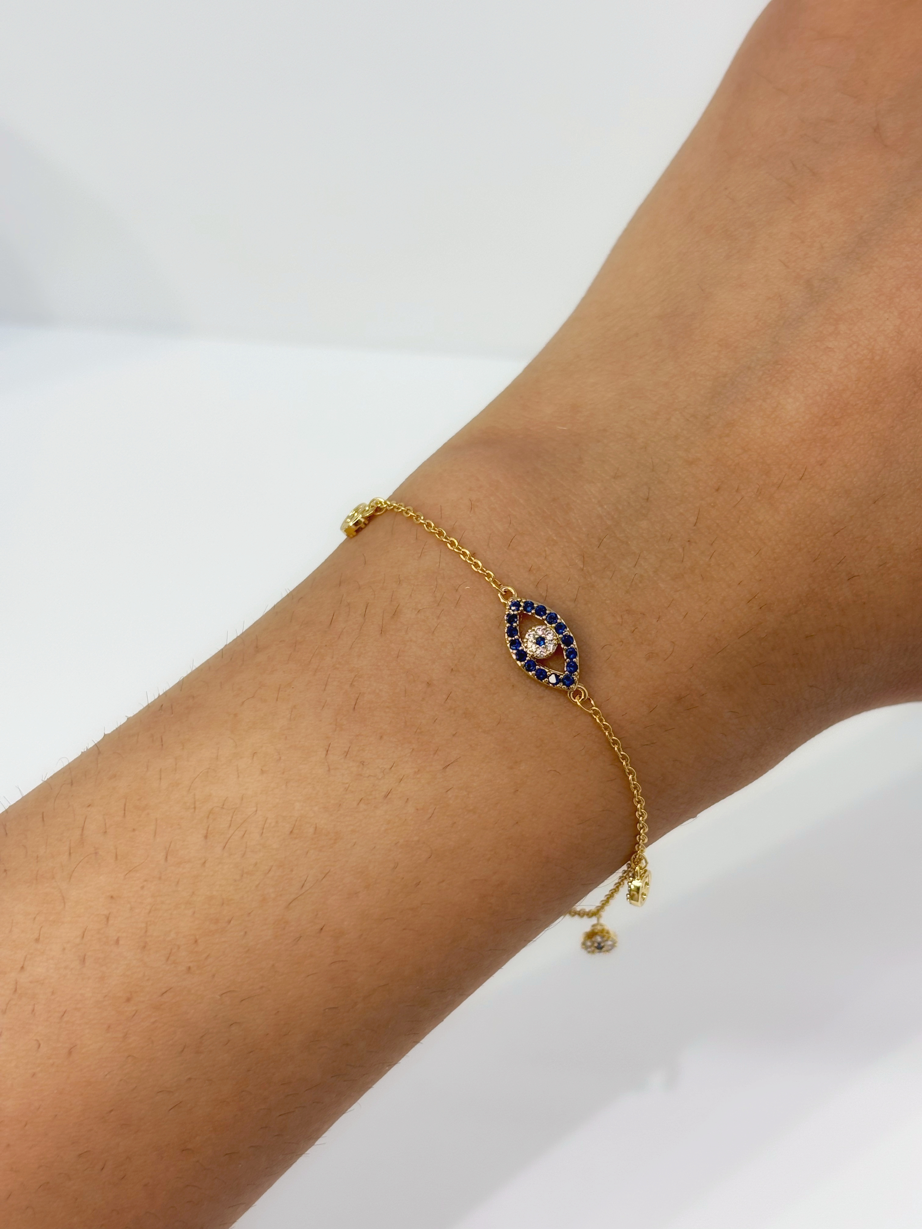 Evil Eye gold plated bracelet worn on wrist