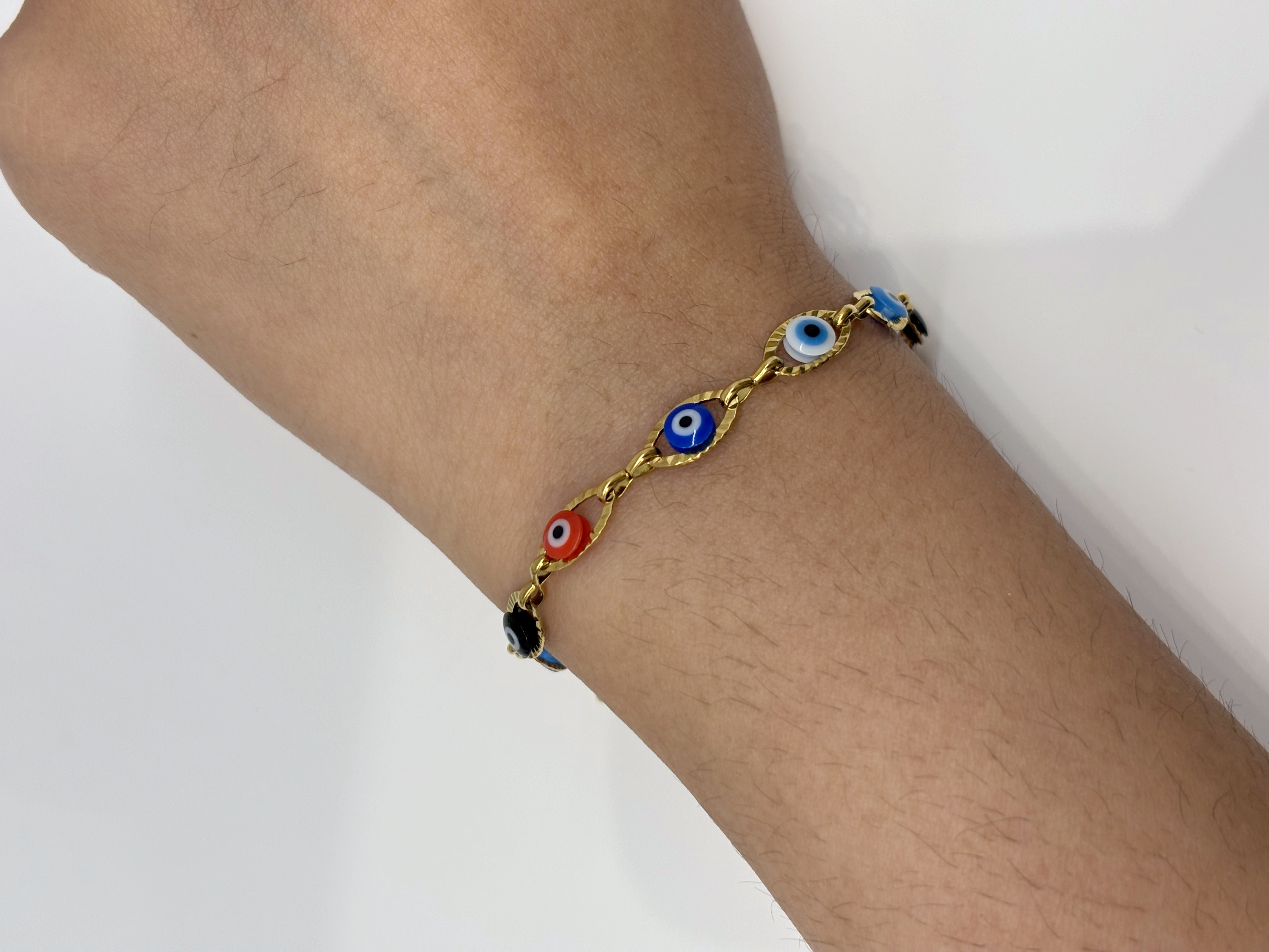 Evil Eye gold plated bracelet worn on wrist