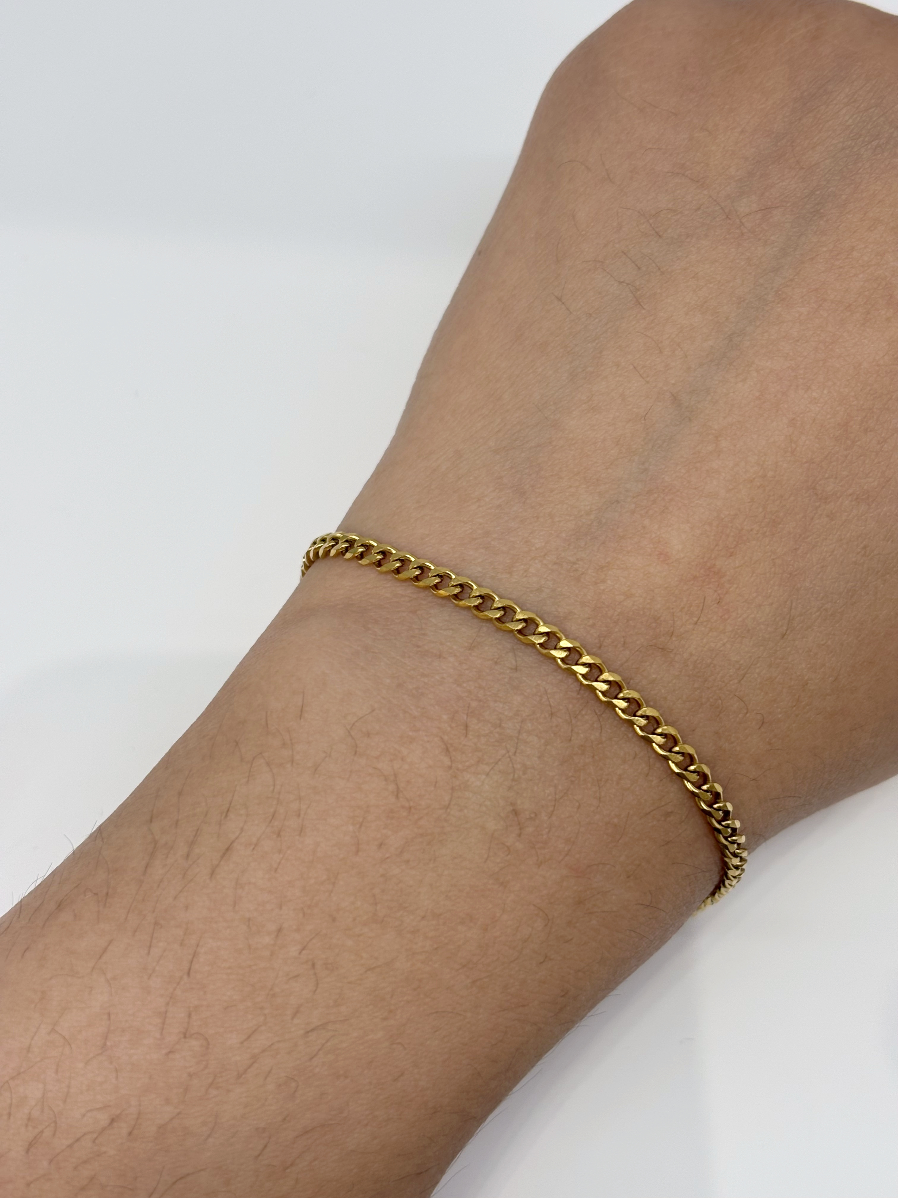 Fine Curb Chain gold plated bracelet worn on wrist