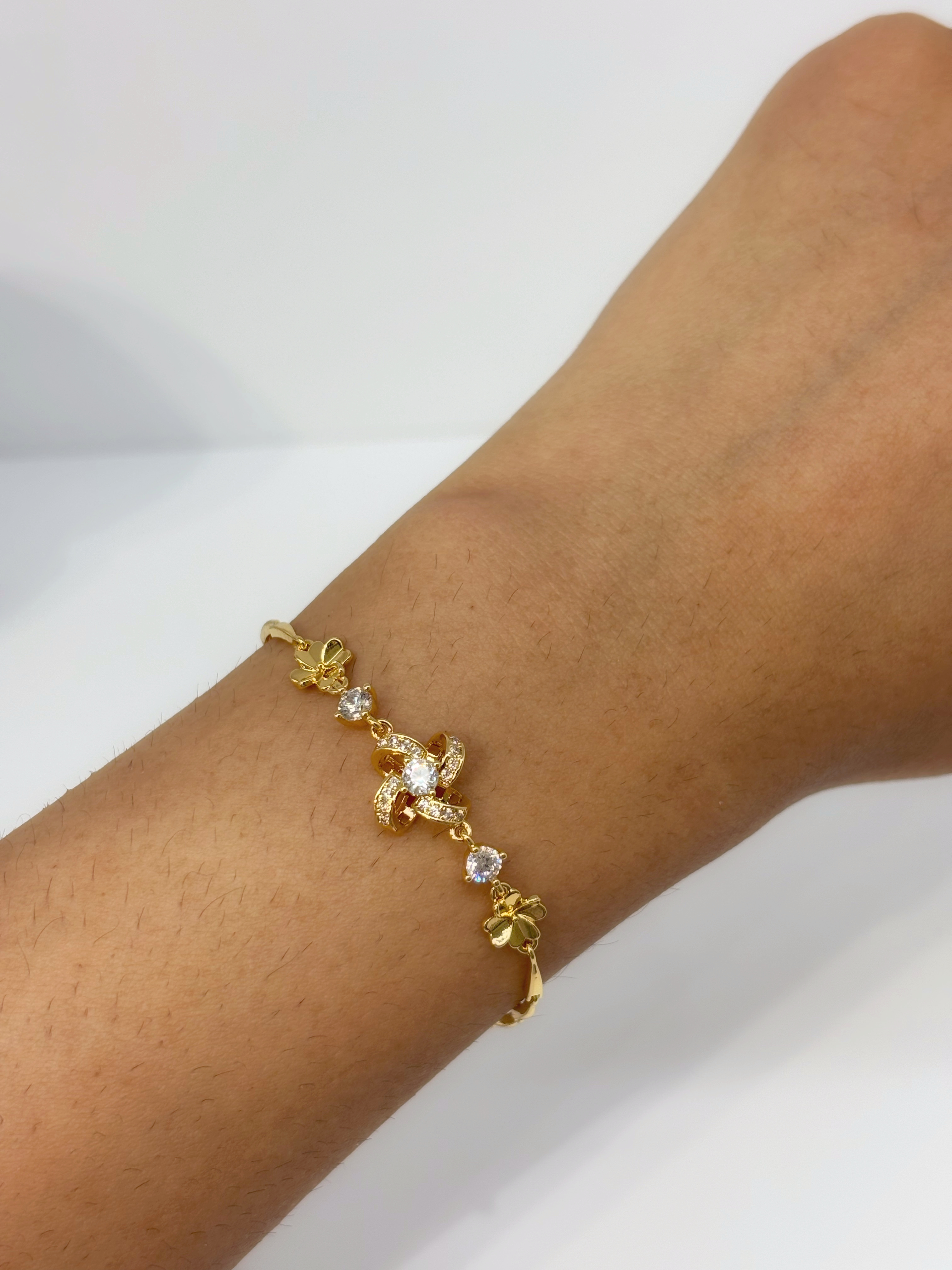 Gold Charm gold plated bracelet worn on wrist