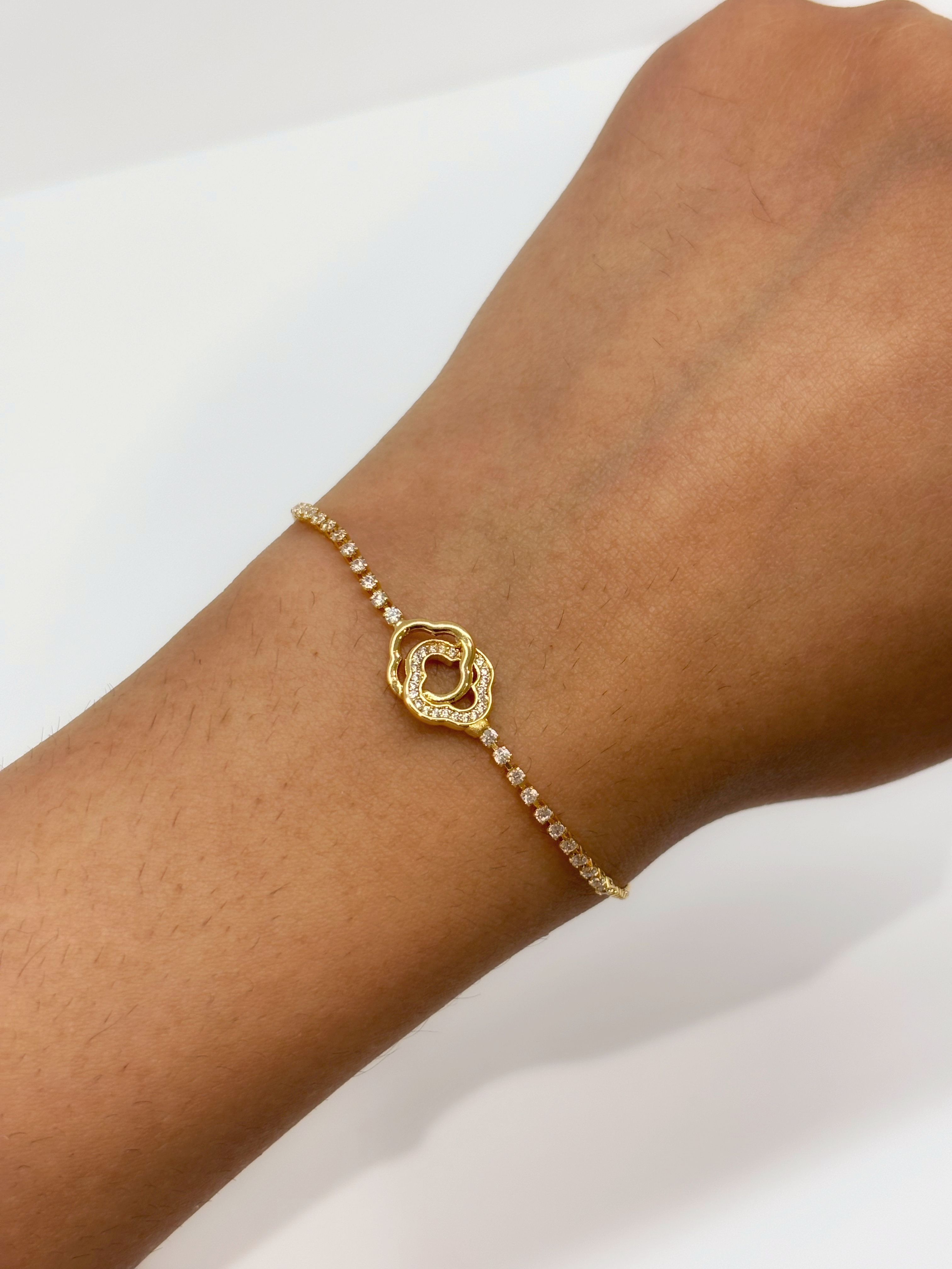Heart Halo gold plated bracelet worn on wrist