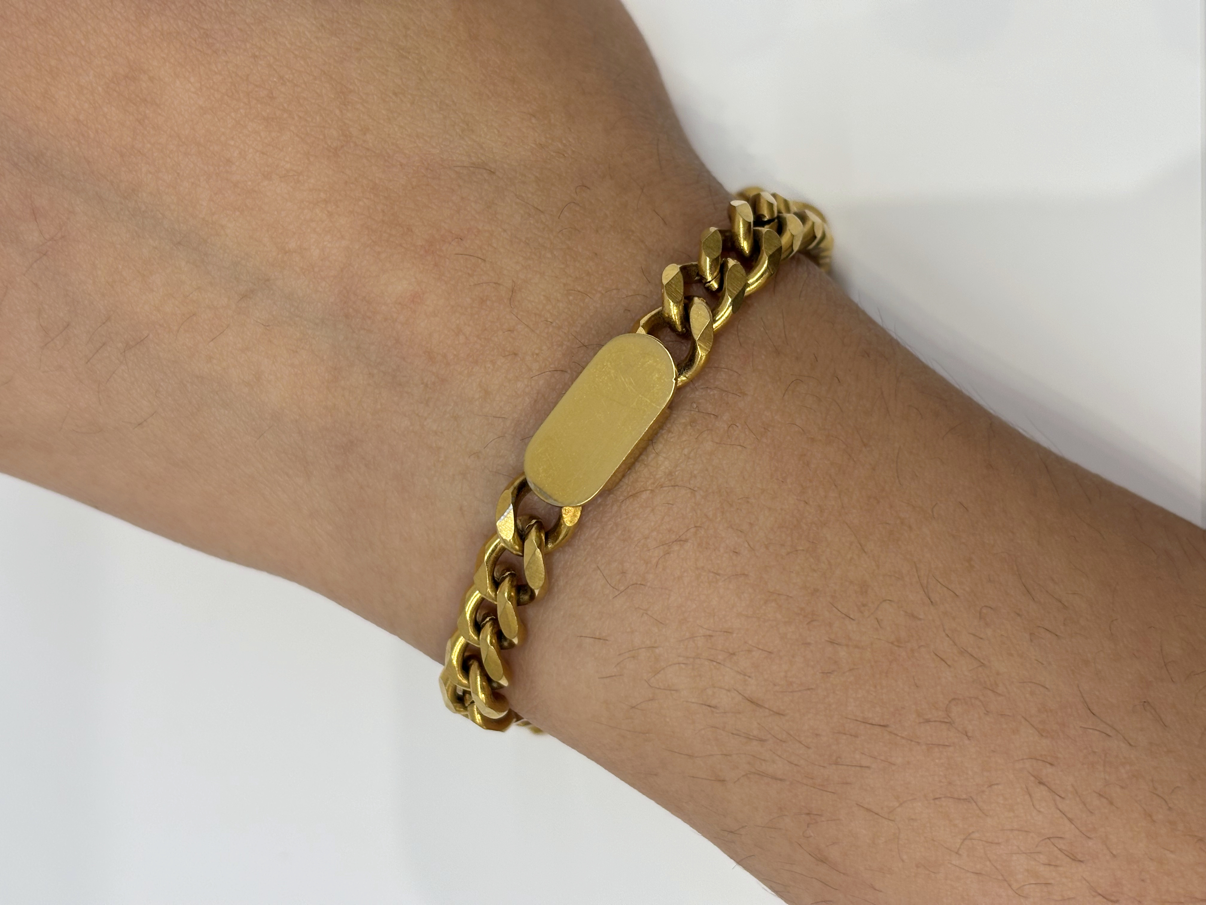ID Chain gold plated bracelet worn on wrist