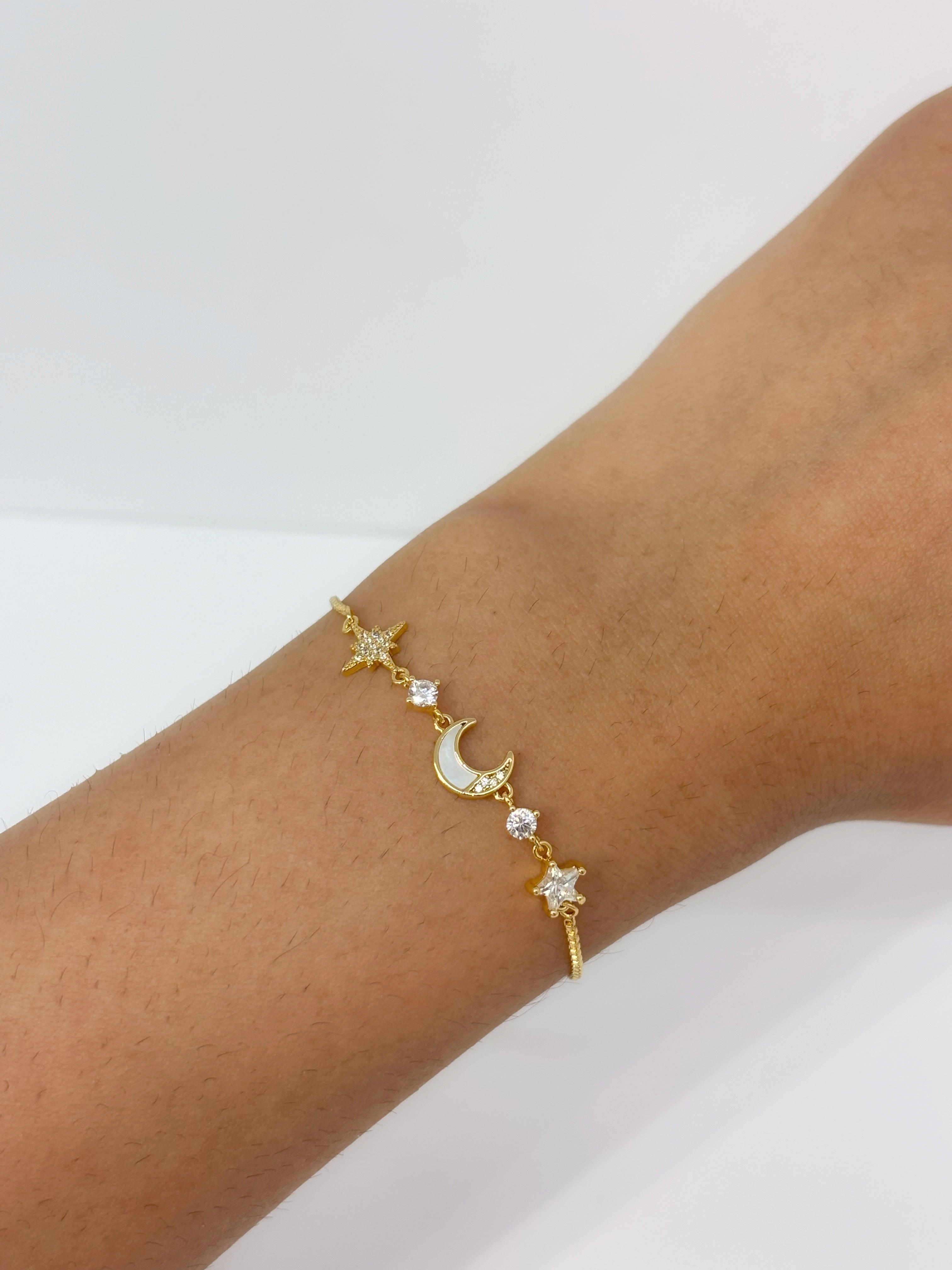 Moon and Star gold plated bracelet worn on wrist