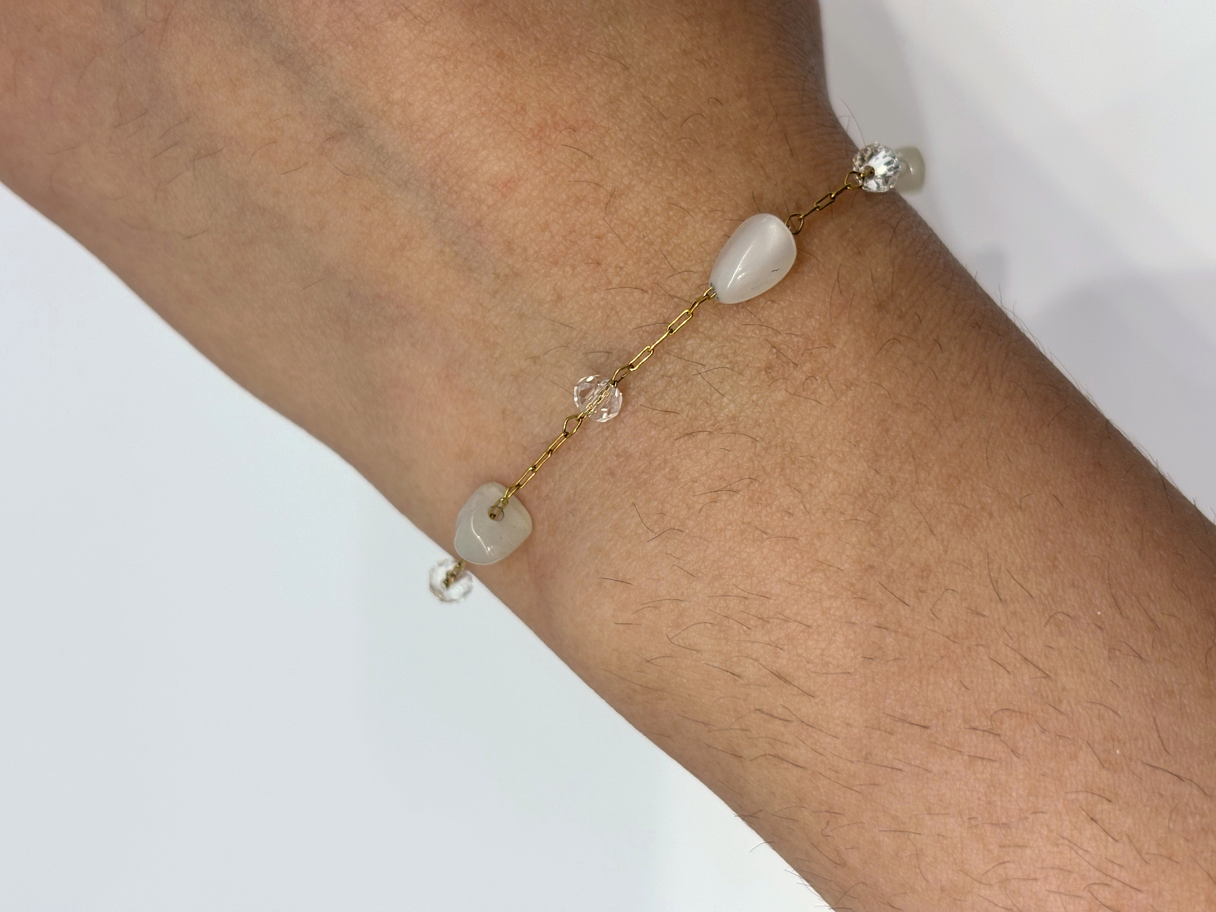 Mother-of-Pearl Station gold plated bracelet worn on wrist