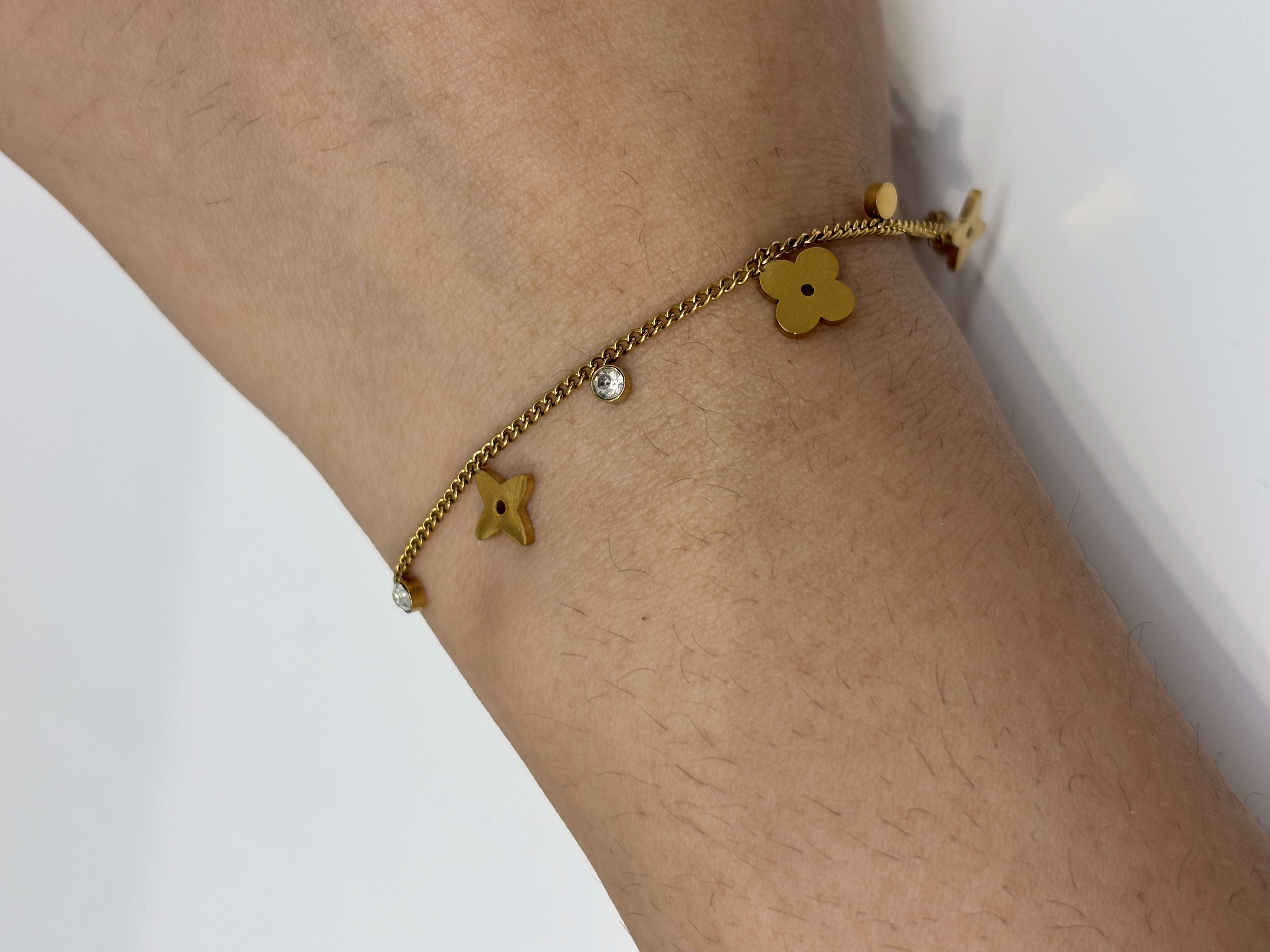 Multicolor Clover Charm gold plated bracelet worn on wrist