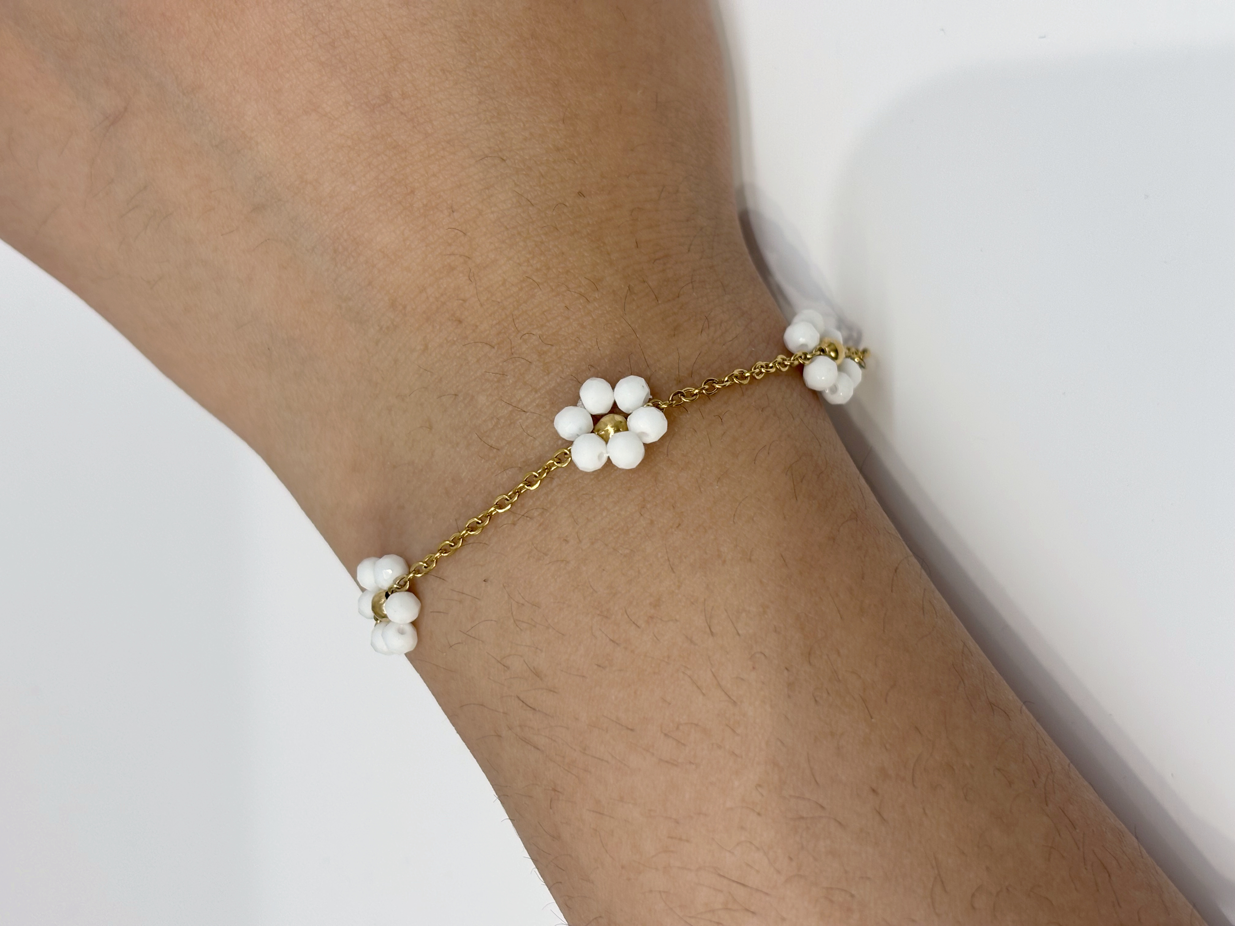 Pearl Flower gold plated bracelet worn on wrist