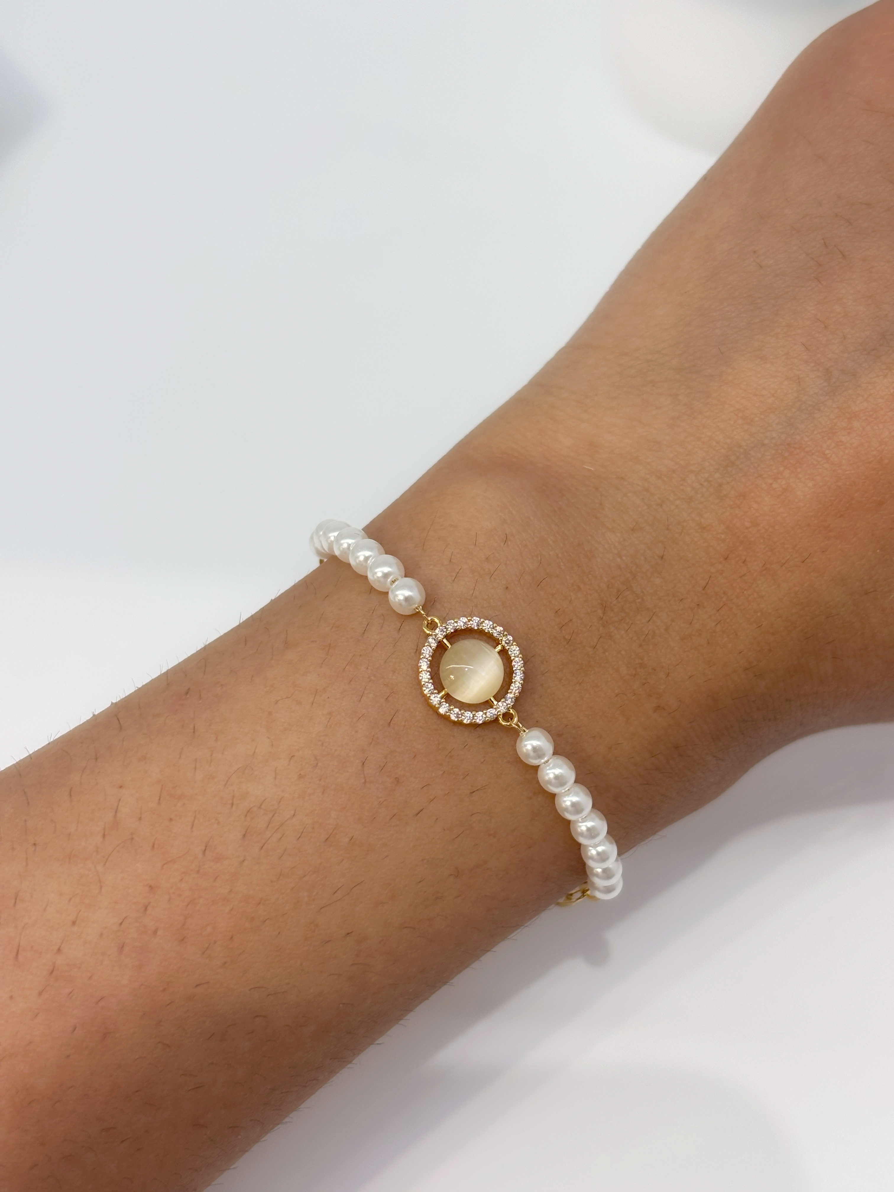 Pearl Halo gold plated bracelet worn on wrist