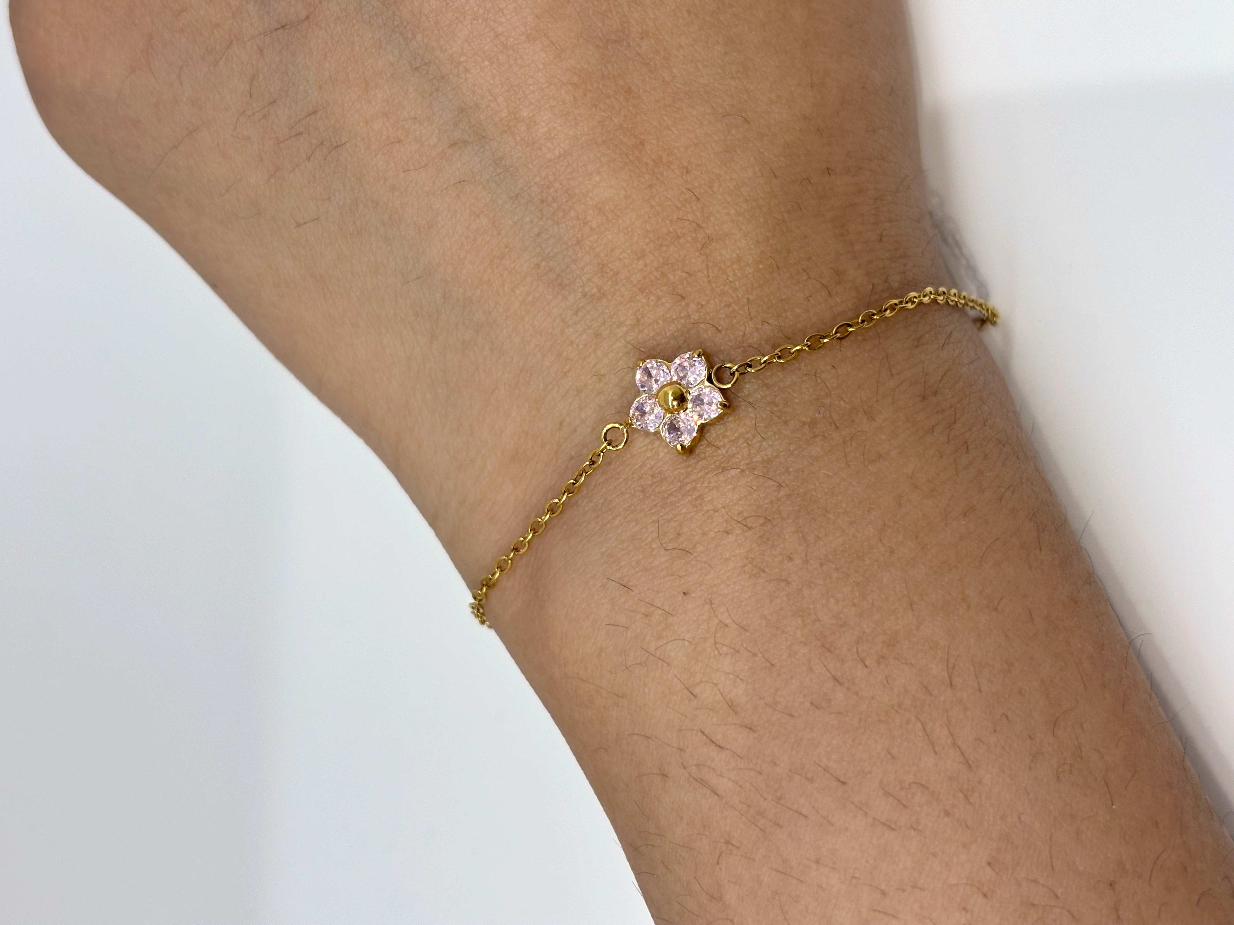 Pink Flower gold plated bracelet worn on wrist