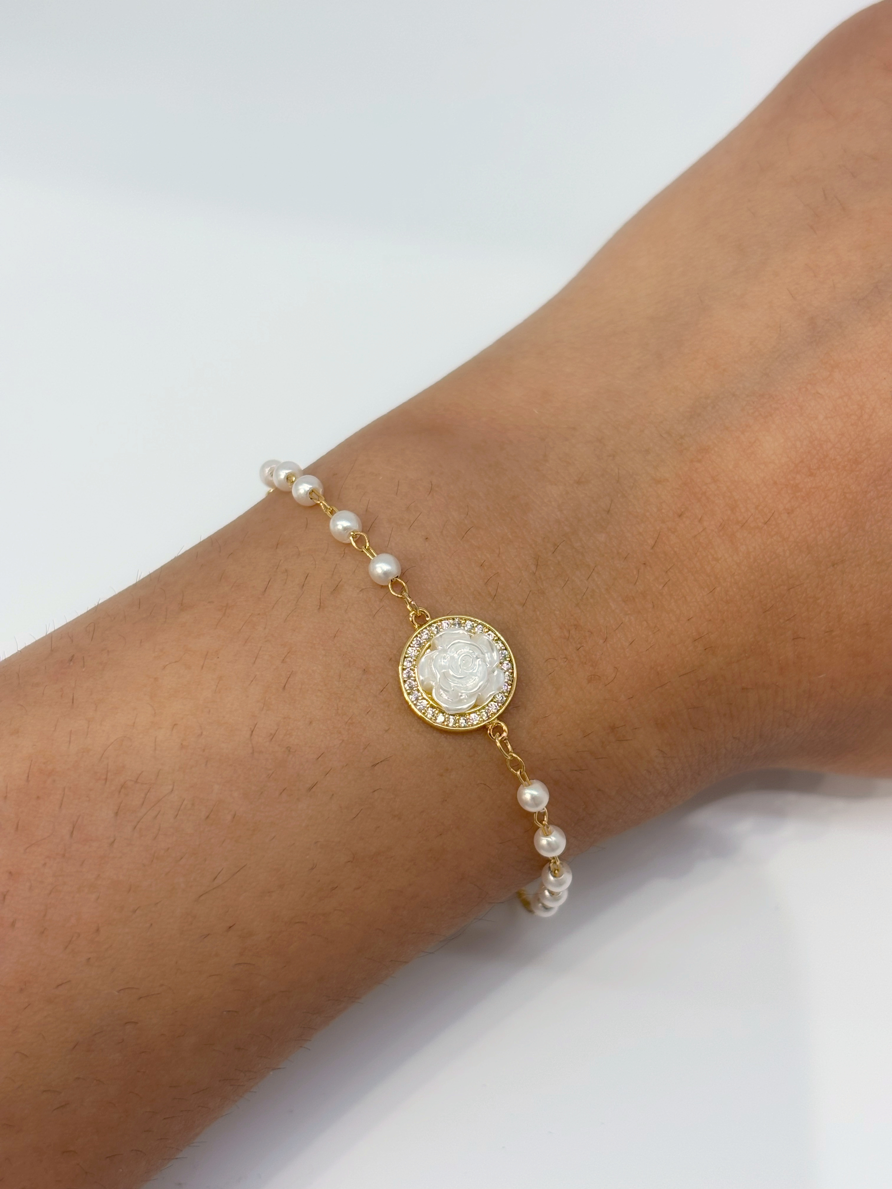 Round Halo gold plated bracelet worn on wrist
