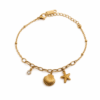 Seashell Charm gold plated bracelet on white background