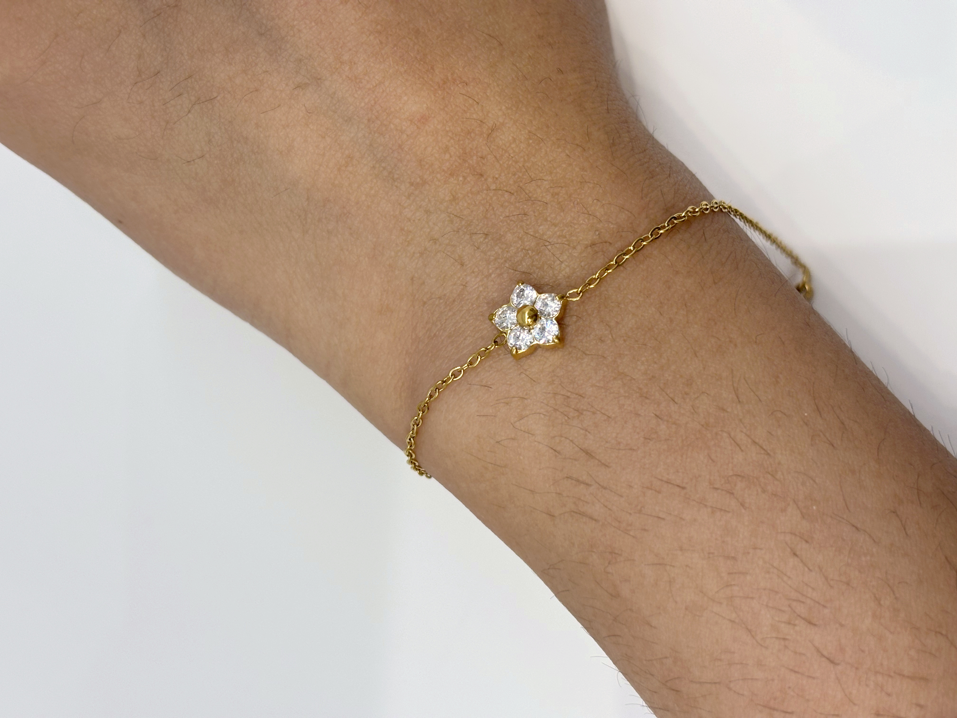 Solitaire Flower gold plated bracelet worn on wrist