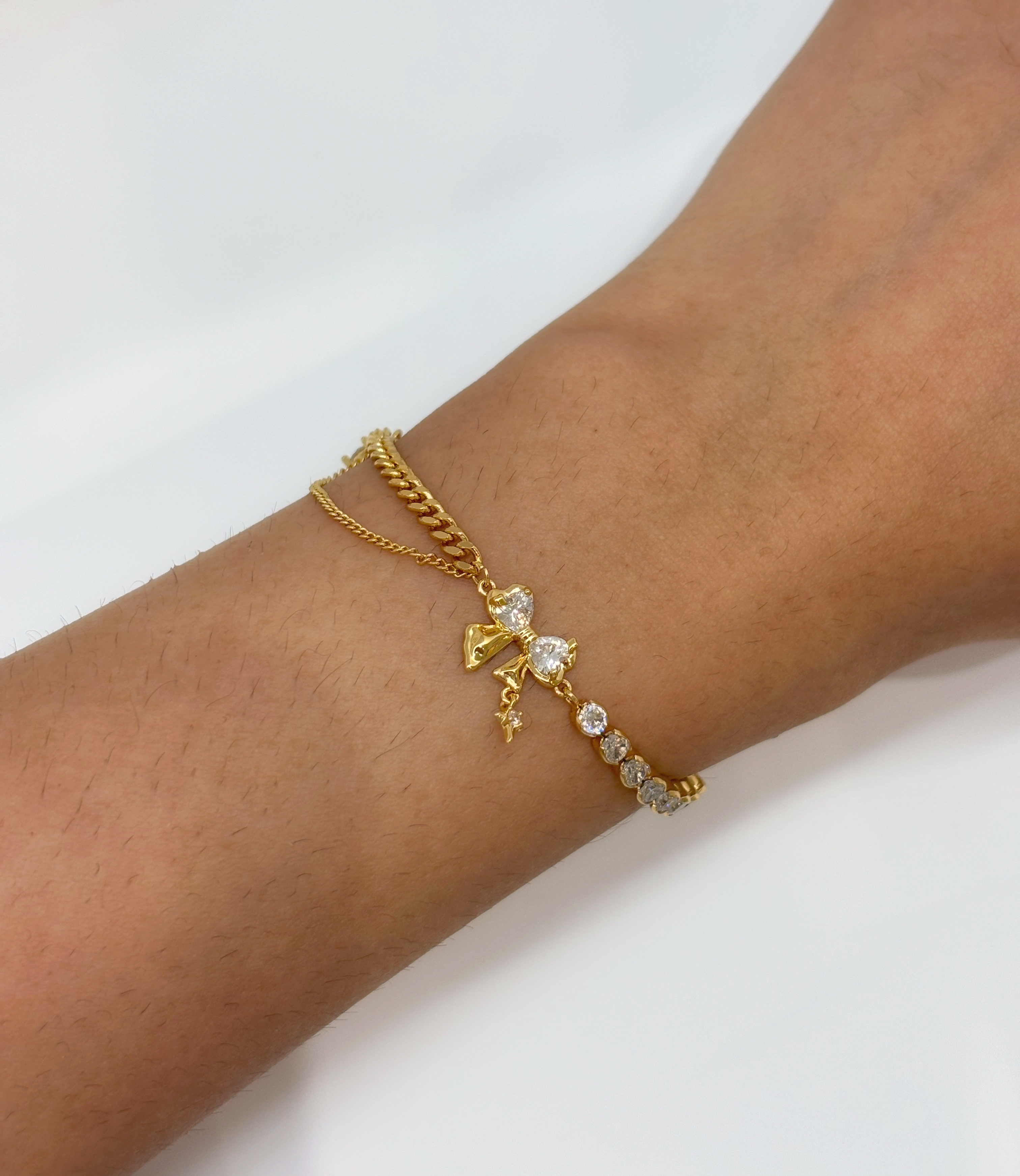 Star and Chain gold plated bracelet worn on wrist