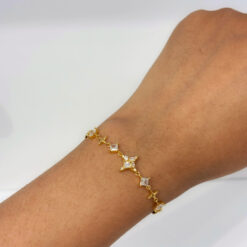 Star Cluster gold plated bracelet worn on wrist