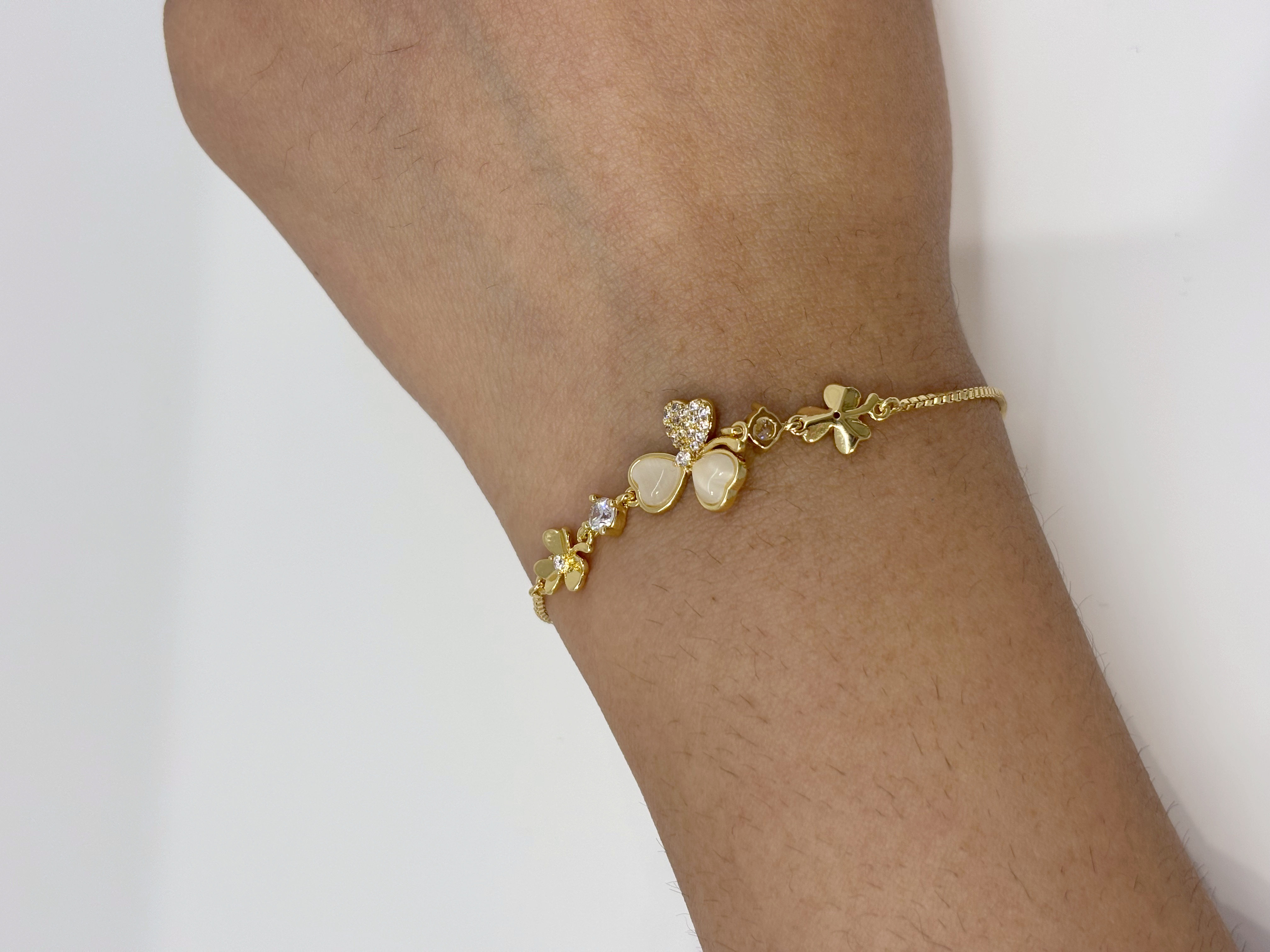 Three-Petal Flower gold plated bracelet worn on wrist
