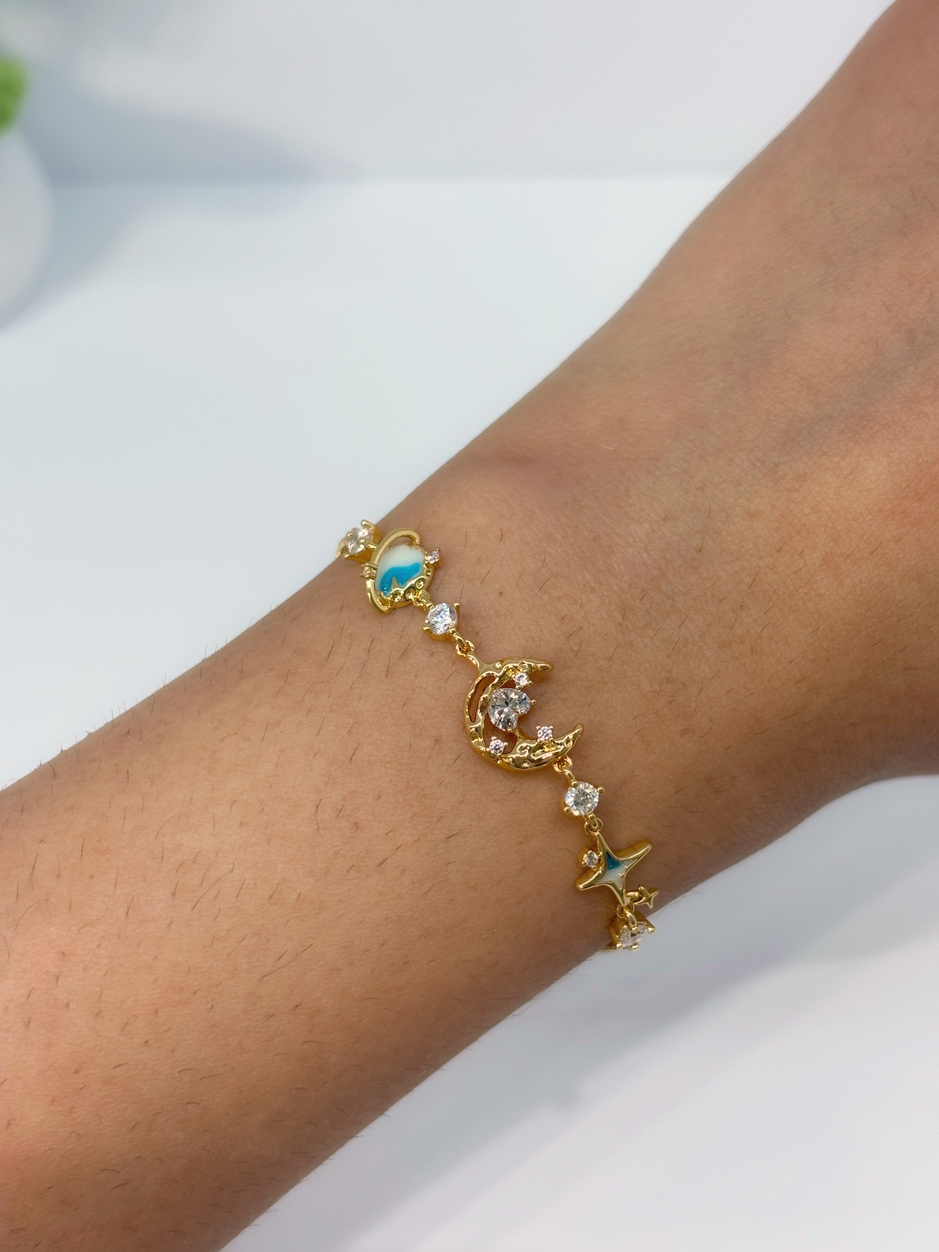 Turquoise Celestial gold plated bracelet worn on wrist